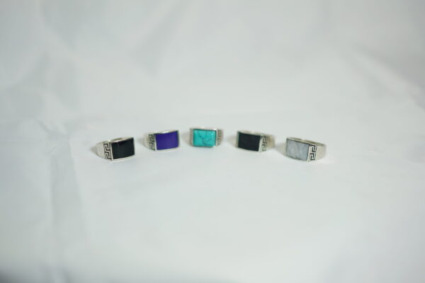 Bold Amazigh signet ring in silver with onyx, turquoise, malachite, or amethyst. Geometric motifs evoke Berber heritage. A powerful, timeless piece. Worldwide shipping.