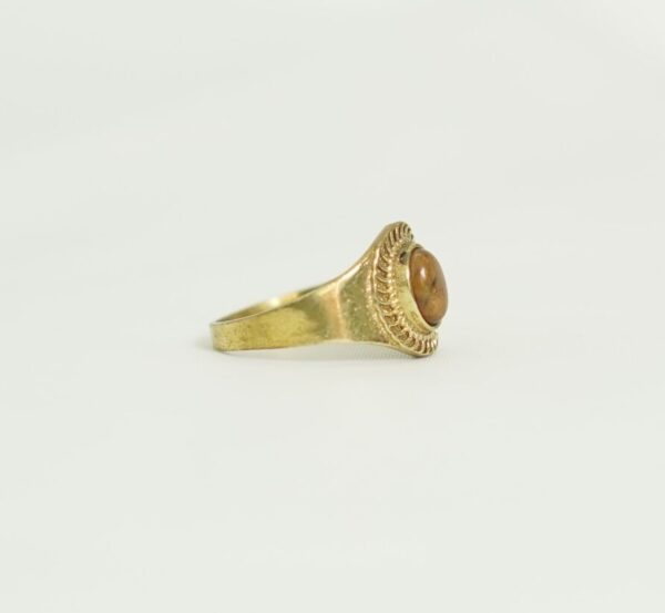 A handcrafted bronze ring adorned with an oval stone and rope detailing. A perfect blend of Moroccan soul and bohemian elegance. Unisex and timeless. Worldwide shipping available.