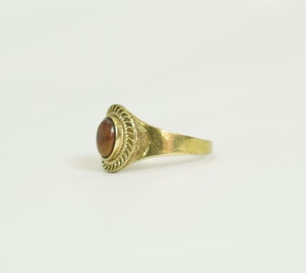 A handcrafted bronze ring adorned with an oval stone and rope detailing. A perfect blend of Moroccan soul and bohemian elegance. Unisex and timeless. Worldwide shipping available.