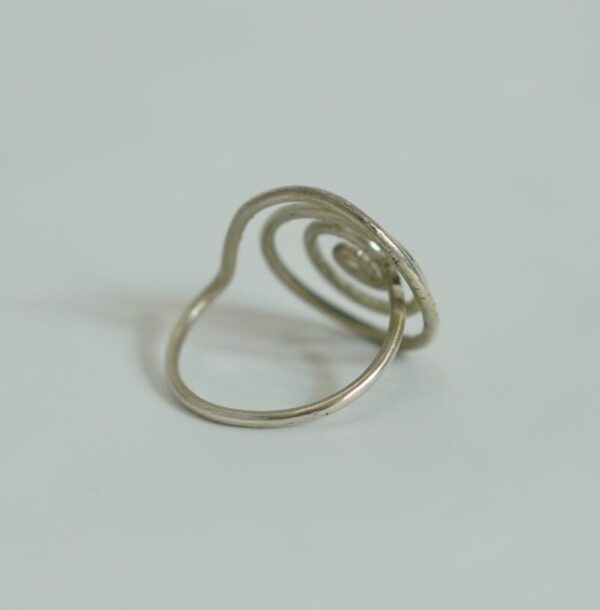 Elegant handmade silver ring featuring a bold spiral motif. A perfect blend of tribal spirit and modern minimalism. Crafted in Morocco.